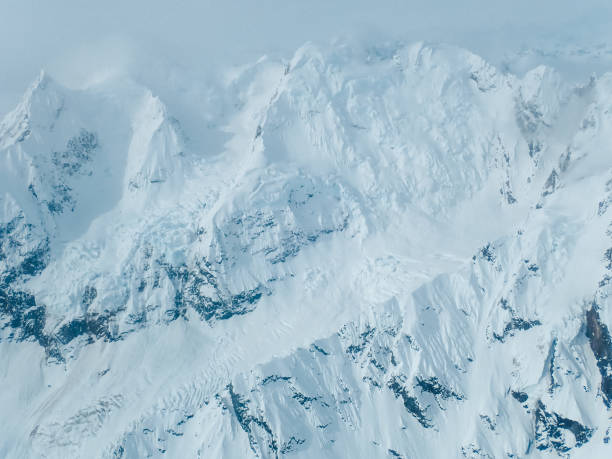 istock Snowy mountain landscape seen from above 1152451170