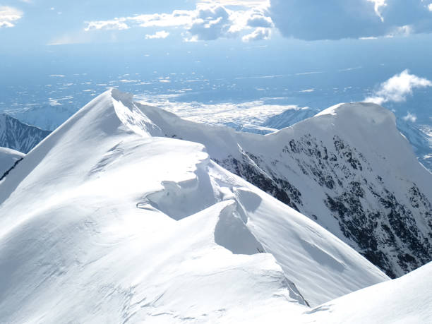 Mountain wilderness. Large peaks covered with snow and ice