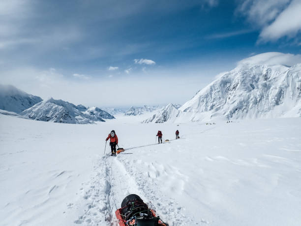 istock Hiking group walking on snowy trail in mountain 1152451234