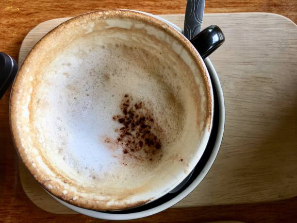 Drinking latte coffee in coffee cafe,coffe cub on table.