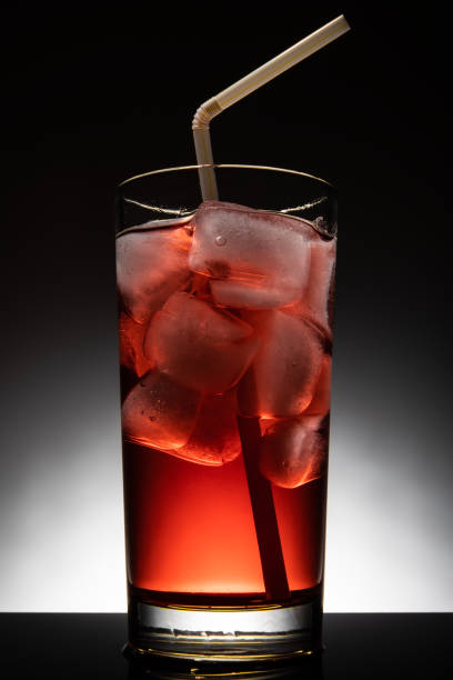 istock Isolated glass with a red cocktail and ice-cubes 1152456376