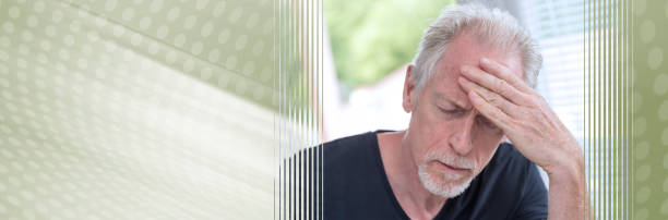 istock Mature man having a headache. panoramic banner 1152456486