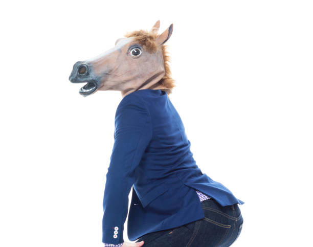 istock Businessman with horse mask is dancing 1152458908