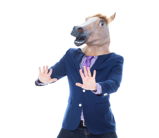 istock Businessman with horse mask is dancing 1152458913