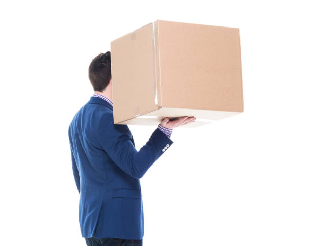 istock Businessman lifting a cardboard box with one hand 1152461867
