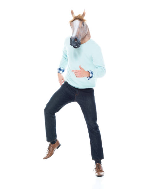 istock Man with horse mask is dancing 1152462535