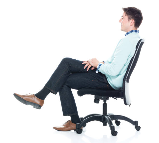 istock Handsome young man sitting and and being happy, side view 1152463780