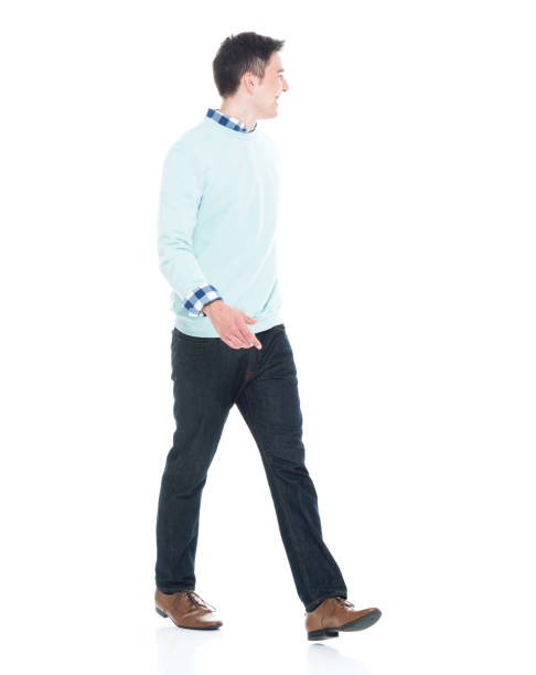 istock Handsome young man walking and looking behind 1152463972
