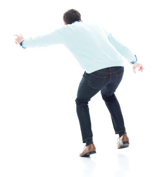 istock Handsome young man walking carefully. Rear view. 1152463977