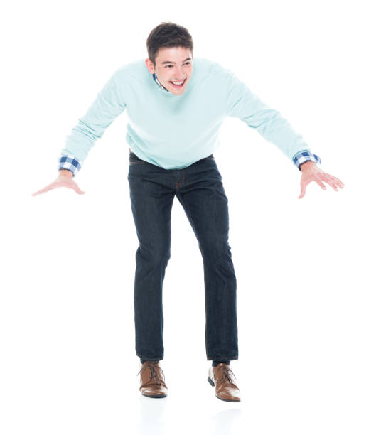 istock Handsome young man walking carefully / tip toe 1152464031
