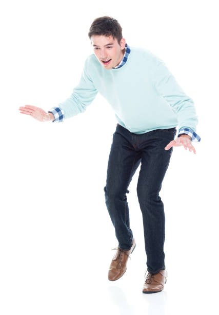 istock Handsome young man walking carefully / tip toe 1152464035