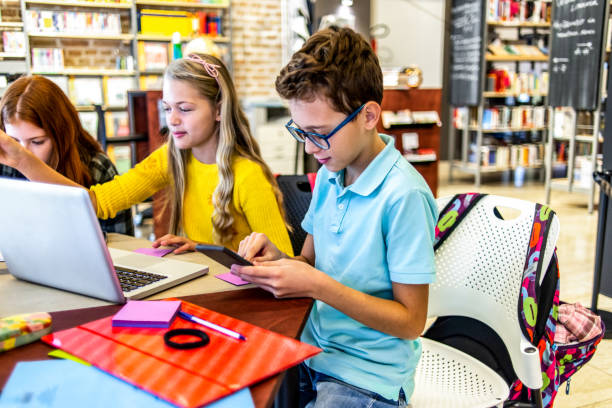 istock group of friends studying together in the library 1152464367