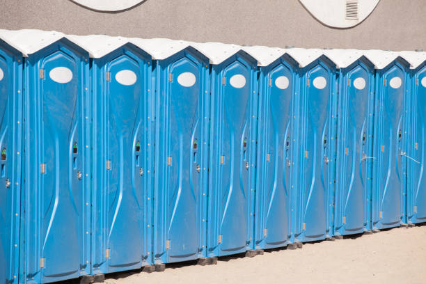 istock Row of blue portable, mobile toilets 1152465068