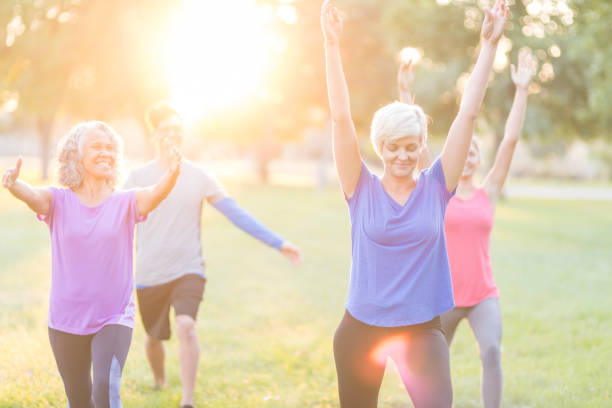 istock Co-ed fitness group exercising outside 1152465393