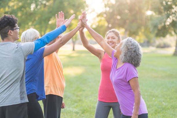 istock Co-ed fitness group getting ready to exercise outside 1152465419