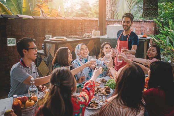 istock a group ph multi ethic friends having a celebration toast at the dinning area at villa during weekend city break 1152465446