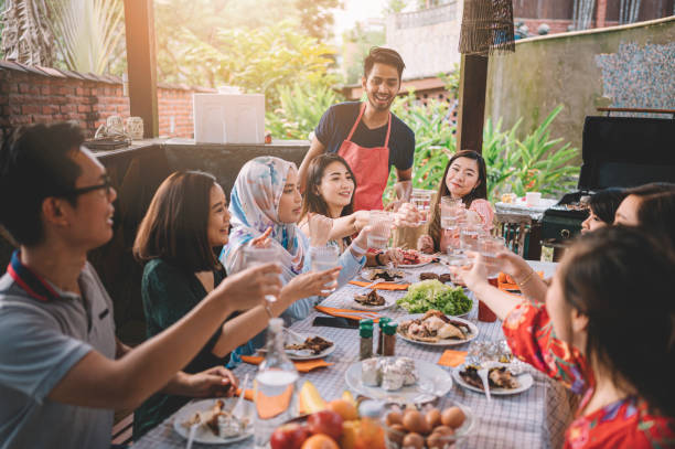istock a group ph multi ethic friends having a celebration toast at the dinning area at villa during weekend city break 1152465499