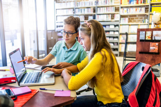 istock group of friends studying together in the library 1152465588