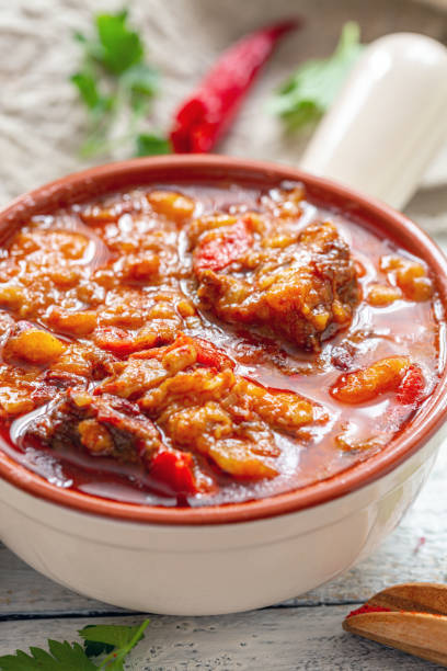 istock Thick meat soup with potatoes and paprika close-up. 1152465620