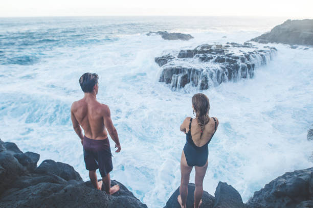 istock A millennial-age couple getting ready to jump into the ocean 1152466502