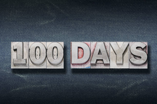 hundred days den one hundred days phrase made from metallic letterpress on dark jeans background 100th day of school stock pictures, royalty-free photos & images