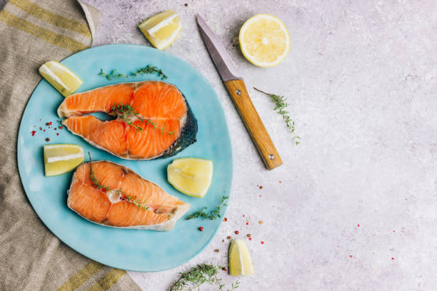 istock Raw salmon fish steaks with ingredients 1152469409