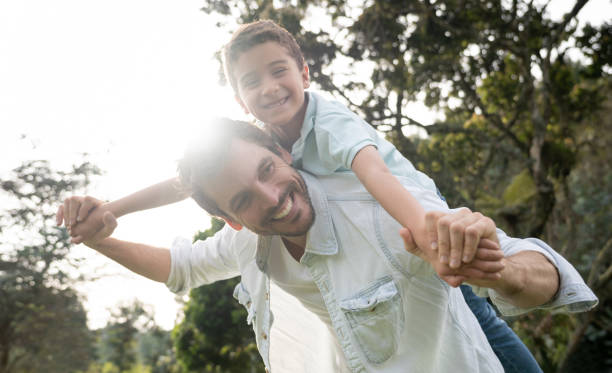 istock Happy father playing with his son outdoors 1152470879