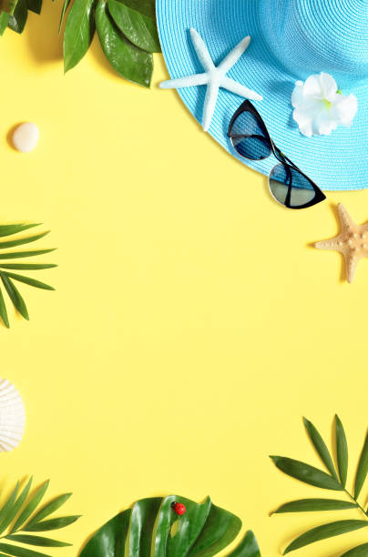 istock Tropical Background. Palm Trees Branches with starfish and seashell on yellow background. Travel. Copy space. 1152471124