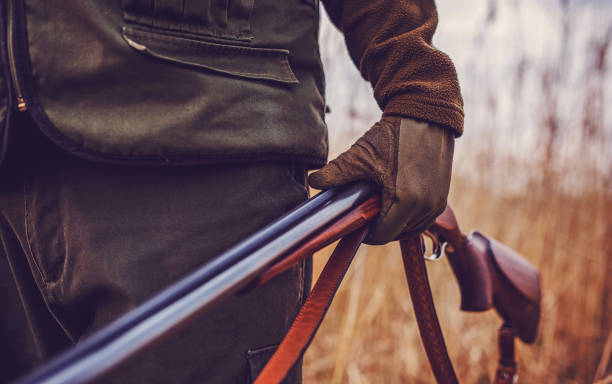 istock Hunter with a rifle in hunting 1152473532