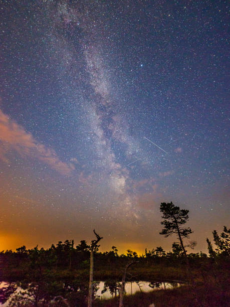 istock night sky with stars and clouds in long exposure shot 1152474656