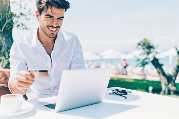 istock Wealthy man in white shirt shopping online 1152474965