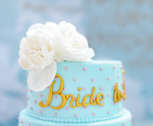 istock Traditional anniversary/wedding multi-layer cake. Beautiful delicious sweet dessert decorated with flowers 1152478742