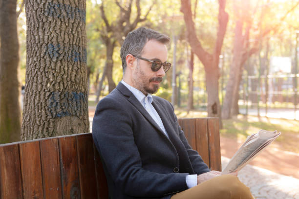 Businessman reading newspaper