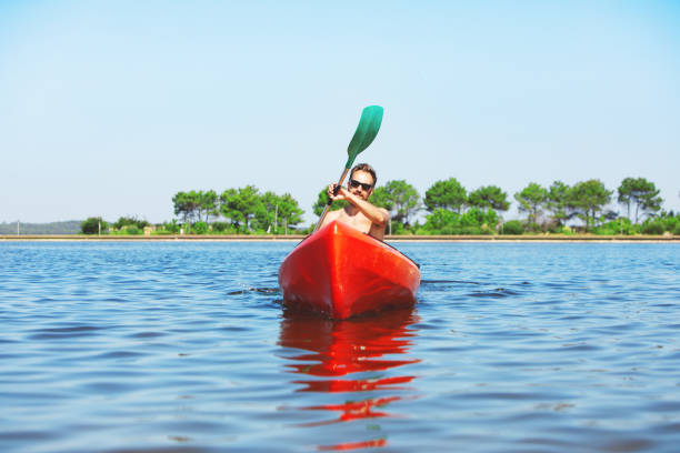 istock Men Rowing Kayak On Lake 1152478948