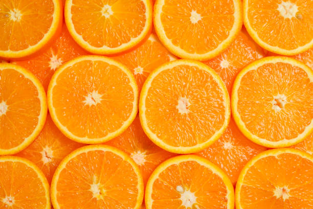 istock Slices of oranges as a background, top view. 1152481434