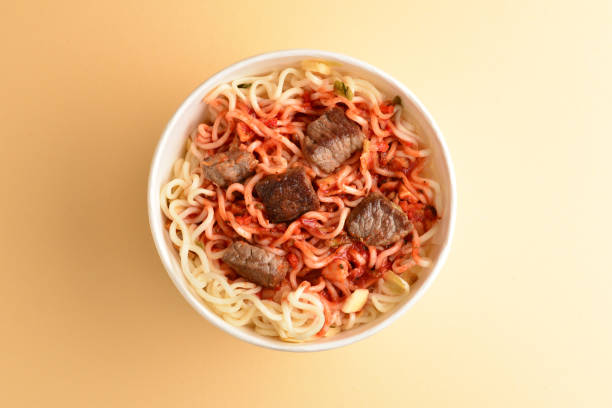 istock Paper cup with instant ramen noodles with beef and vegetables. 1152481436