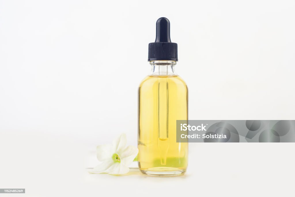 Winged Tobacco Essential Oil In Beautiful Bottle On White Background Stock  Photo - Download Image Now - iStock