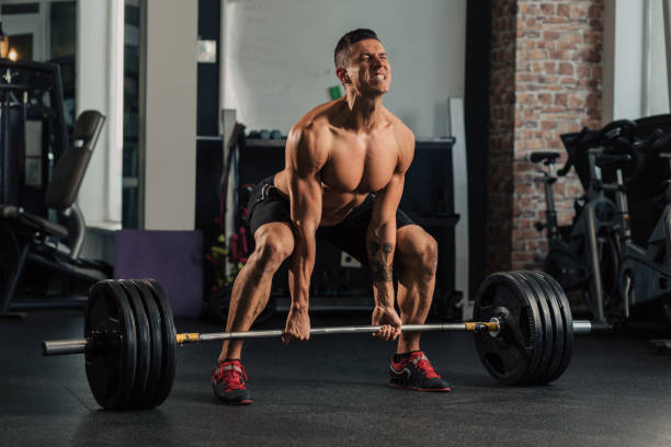 istock Young muscular man in the gym doing exercise 1152491266