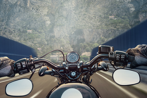 POV shot of young man riding on a motorcycle
