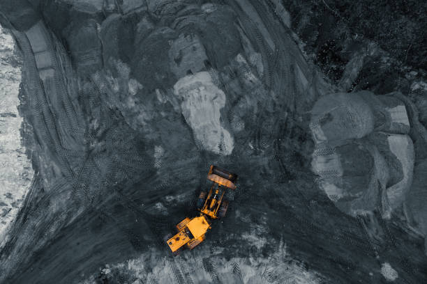 istock Yellow excavator or bulldozer in coal open cast mining quarry, industrial extraction of minerals, aerial top view 1152493271