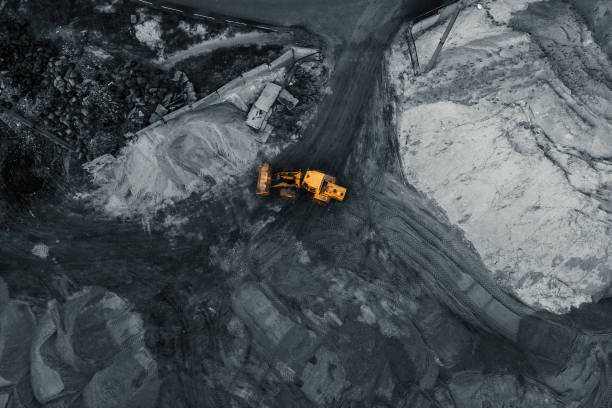istock Yellow excavator or bulldozer in coal open cast mining quarry, industrial extraction of minerals, aerial top view 1152495867