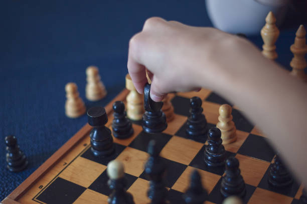 istock Grandson playing chess against his grandmother 1152496848