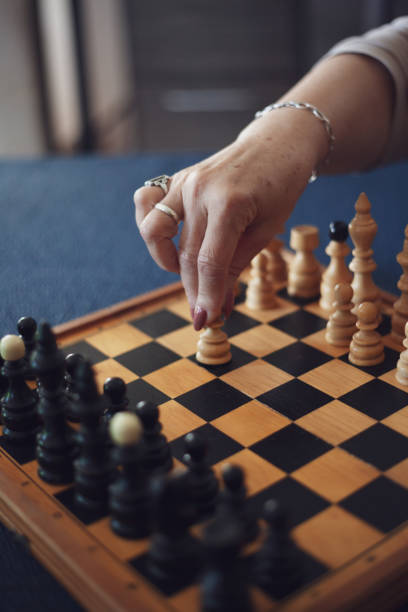 istock Grandson playing chess against his grandmother 1152496966