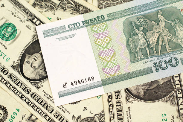 istock A Belorussian ruble bank note with American one dollar bills 1152498774