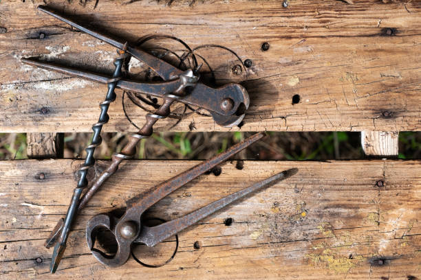 istock Antique hand tools drill and pliers. Work professions. Old brown boards look from all over. Copy space 1152499742
