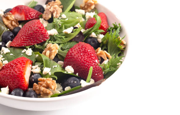 istock A Bright Garden Salad with Fresh Fruit Isolated on a White Background 1152500229