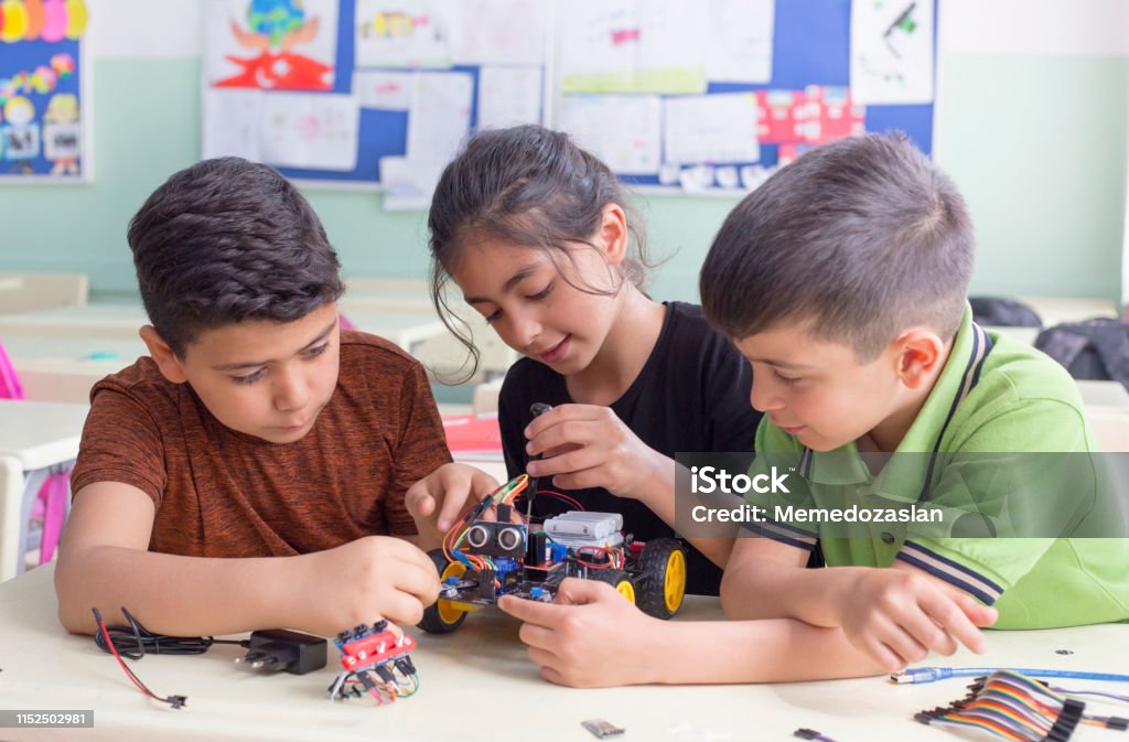 turkish student group are developing the robot in the classrom Child Stock Photo