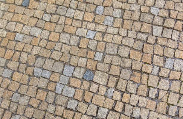 Old road paved with granite stones.