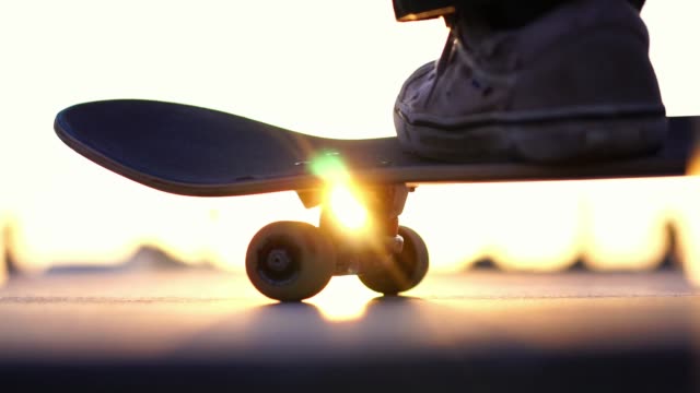 Close up skateboard in sunset light, Venice Beach skate park, Los Angeles, California