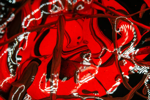 istock Red and Black Thick Paint Lines and Abstract Splatters on Canvas 1152508222